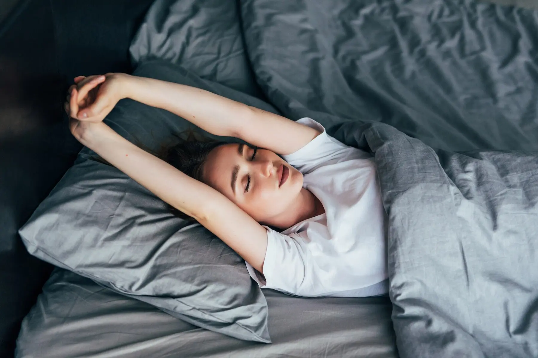 A collection of colorful and cozy pajamas displayed neatly on a bed, inviting a sense of comfort and relaxation.